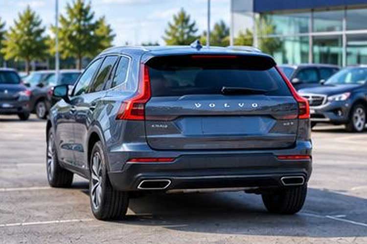 Inspected grey SUV parked outside a dealership, ready for its next owner
